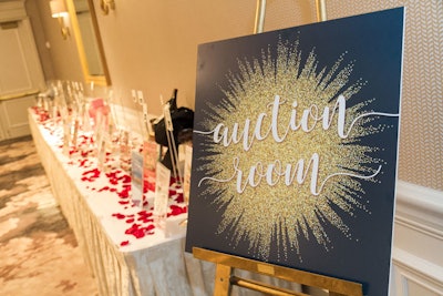 The sparkle graphic design from the invite was utilized throughout the event signage.