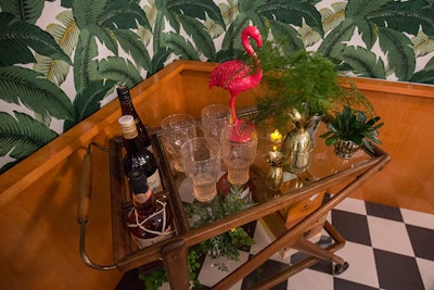 The Havana-style booth also had a bar cart stocked with plants and a bright pink flamingo. Though this bar cart was merely a prop, a nearby bar served drinks from sponsor Patron.