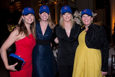 Some guests showed their team spirit by pairing Cubs hats with their gowns.