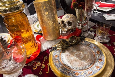 A table by Stone Source had an apparent steampunk theme. Vintage pilot goggles adorned place settings; the table was strewn with gears, elaborate keys, and glittering skulls.