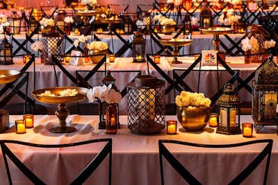 At NBC Universal’s Golden Globes party in Los Angeles in January, candlelight and varying metallic objects dotted long communal tables under pierced metal chandeliers as the focus in the center of the party space.