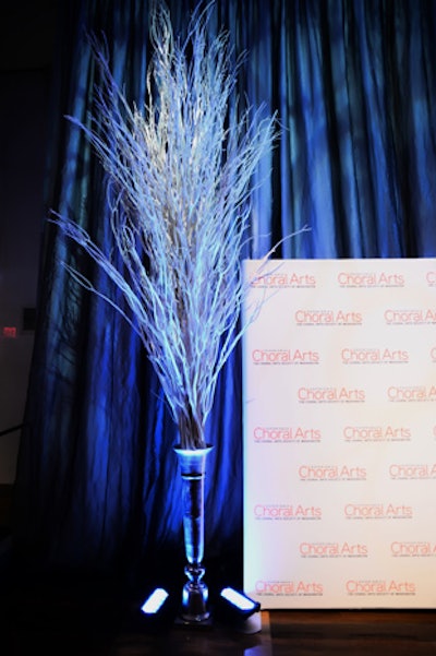 Artist Ugo Rondinone created the sculpture that inspired Duran Floral Design to decorate with these six 12-foot white Mitsumata trees, which flanked the step-and-repeat and bars at the far ends of the room.