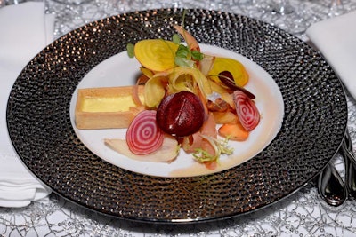 Restaurant Associates served gruyère and emmental custard tart with shaved root vegetable salad and a banyuls vinaigrette for the first course.