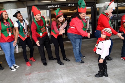 Delta Air Lines team members dressed as elves greeted children from the Children's Hospital Los Angeles and P.S. Arts for the sixth annual event.