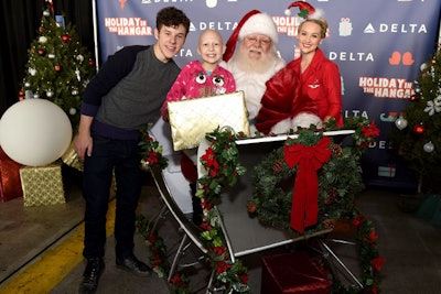 Children had the opportunity to take pictures in Santa's sleigh, with guests including Modern Family actor Nolan Gould.