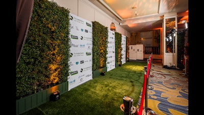 Farm Sanctuary event with mixed hedge and gator printed press wall