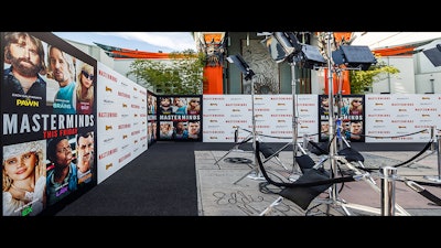 A printed canvas step and repeat at the 'Masterminds' movie premiere in Los Angeles