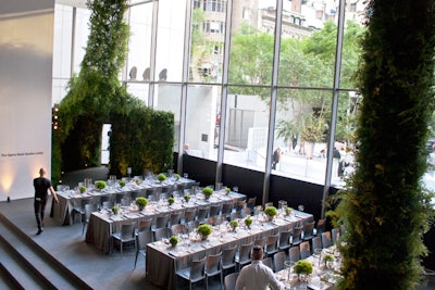 At the Museum of Modern Art's Party in the Garden in New York in June, guests gathered among lush garden-like vibe with layers of greenery. Guests entered the the main dining room through a foyer with a drape of greenery sweeping up to the ceiling, resembling a lush forest landscape.