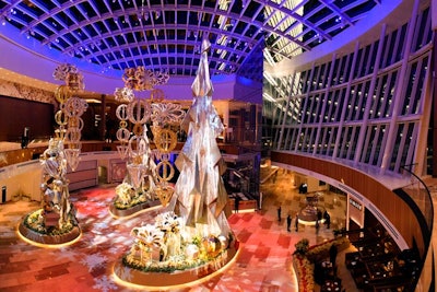 Designer and event planner Ed Libby of Ed Libby & Company Events conceived the MGM National Harbor's centerpiece, which is a floral wonderland that spans 15,000 square feet. The current display, “Holiday Reflections,” features more than 150,000 flowers in a contemporary holiday scene.