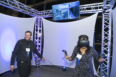 Snap Entertainment’s virtual-reality experience projected the images from the headset onto screens surrounding the top trussing so attendees could see the user’s view.