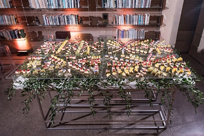 Ridgewells worked with Philippa Tarrant and Syzygy Event Productions to design a mosaic-style display for the cheesecake bites, each topped with fruits such as mango, currants, or kiwi.