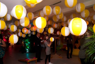 On the second level, a beach ball installation hung from the ceiling. The area also included oversize pool toys.