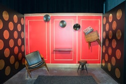 The Levitation room gave guests an Instagram-worthy photo op by inviting them to recreate a scene from the show by positioning themselves on an elevated platform against a red backdrop, which featured furniture and records staged to appear as if they're floating.
