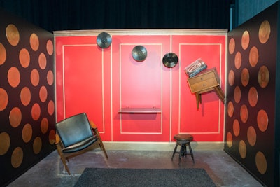 The Levitation room gave guests an Instagram-worthy photo op by inviting them to recreate a scene from the show by positioning themselves on an elevated platform against a red backdrop, which featured furniture and records staged to appear as if they're floating.