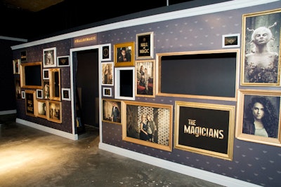 The lobby of the experience featured a number of show-related installations, including a portrait wall with images of characters and the show's title.