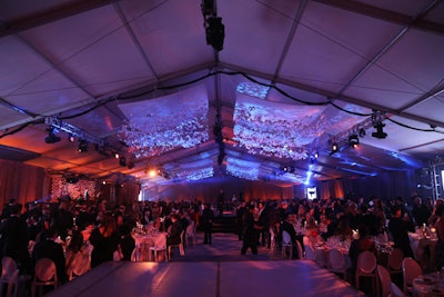 A ceiling installation featuring suspended paper butterflies floated above the space.