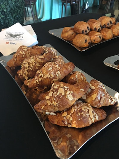 The media reception's committee served a mix of almond and plain croissants as well as pain au chocolat paired with mimosas and champagne for the preview of the Coco Chanel exhibit.