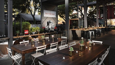 A snazzy dining set-up at Container Bar, featuring our French 75 chairs and Harvest Table.