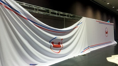 Couchbase 60 Feet Fabric Print Wall in progress designed by Mark Stephen Experiential Agency