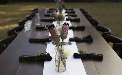 A closer look at our sleek and stunning Harvest Table; no linens necessary!