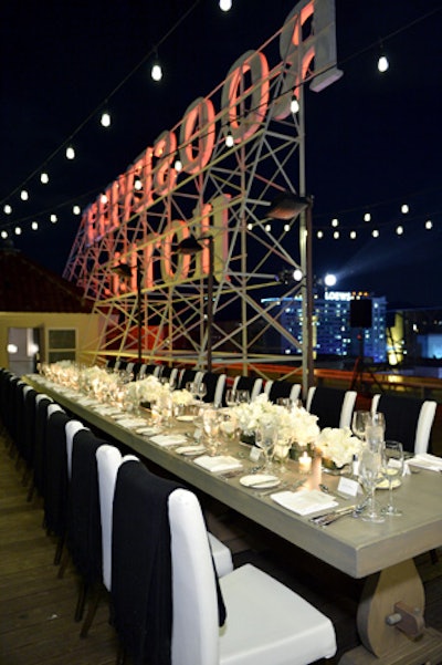 In November, A.F.I. Fest presenting sponsor Audi hosted a private dinner in Los Angeles. Letting the Hollywood Roosevelt rooftop's visual drama speak for itself, the dinner set-up included a simple, unclothed table set with monochrome white chairs and flowers.