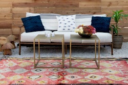 A gorgeous, chic and modern lounge featuring our Shandy Couch and Black Leather Paloma Chairs.