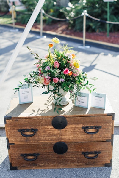 Cheerful floral arrangements by Designs by Darenda decorated the outdoor seating area.