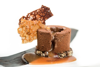 A chocolate mousse parfait with chocolate-macadamia crumble from Abigail Kirsch is filled with liquid caramel bourbon and blood orange sauces and is garnished with a toasted macadamia tuile.
