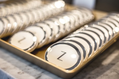 Guests scooped up branded compact mirrors as takeaway gifts. They could also leave with a free, flapper-inspired headband decked with feathers or dangling jewels.