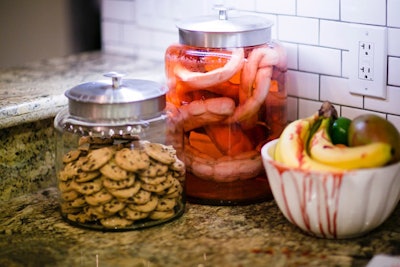 Next to a cookie jar and bloody fruit bowl sat faux entrails in glass.