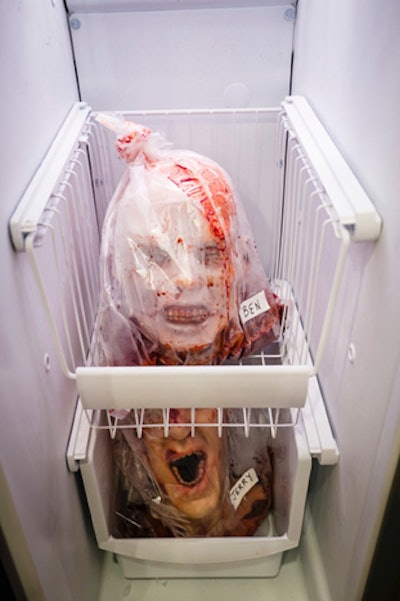 Decor included a freezer stocked with human heads.