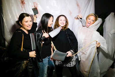 A photo booth encouraged guests to pose in an environment meant to look like a grocery store-style meat package.