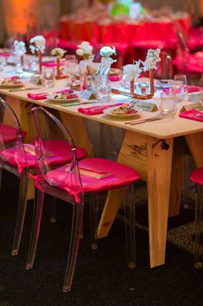 Along with round tables, seating arrangements included sawhorse tables with copper pipe centerpieces.