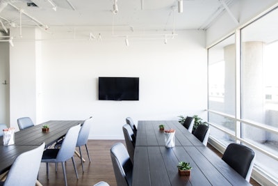 Large Tables Blue Chairs and Apple TV
