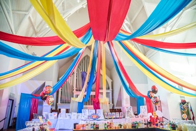 Red, blue, and yellow drapery defined the main event space in the school's church.