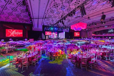 Event producer Julie Hanson designed the event around the nonprofit's red logo with purple accents in flowers and lighting.