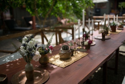 At the Retreat at the Sparrows Lodge in Palm Springs during Coachella in 2015, sparse arrangements of succulents and wildflowers, alongside taper candlesticks and other objects, lent a bohemian atmosphere to a long table.