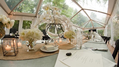 This clear tent in a backyard created the perfect place for an elegant dinner.