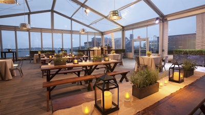 A clear tent and natural décor made inside feel like outside at the rustic dinner.