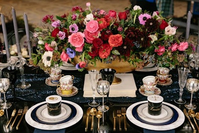 Designer Dana created elegant multicolored floral looks, with abundant blooms spilling from opulent vessels.