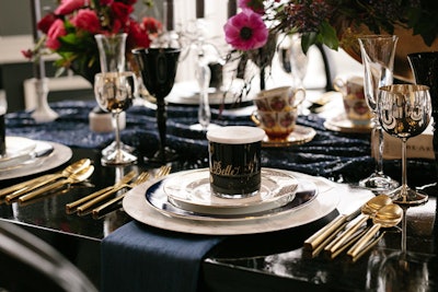Custom marble-print chargers and vintage silver goblets from Soiree8 topped the table.