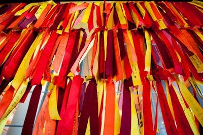 Before leaving, guests tied ribbons onto a wall that will stay up permanently at the new facility