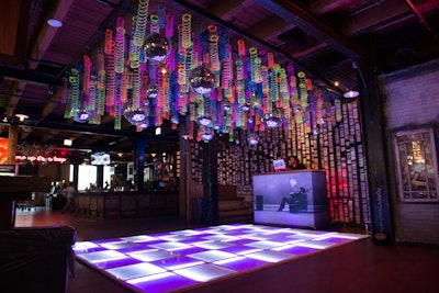 Kehoe Designs created a custom Slinky installation to hang above the venue's light-up dance floor.