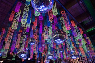 The custom installation combined glittering disco balls with glow-in-the-dark toys.