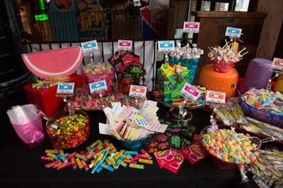 Along with savory snacks such as falafel sliders and Italian beef, guests ate desserts from a vintage candy bar. Decorated with prop cassette tapes, the bar had bowls of Dots and other nostalgic treats.