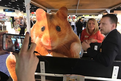 The Global Pet Expo's new social media mascot, Hamlet the Hamster, joined American Pet Products Association executive vice president Andy Darmohraj during a Facebook Live tour of the show floor Wednesday morning. Organizers created the five-foot-tall cutout of a hamster—and the hashtag #hamletthehamster— to create a fun photo opportunity for attendees.