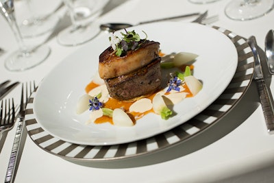 The main course also incorporated foie gras in a brioche atop a petit filet to create Tournedo Rossini served with roasted baby vegetables, Madeira jus, and foie gras anglaise.