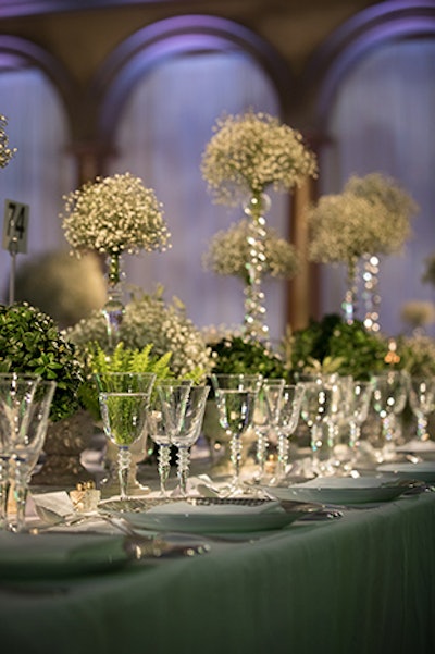 The Italian Ambassador requested event planner David Tutera create a modern interpretation of Italy in the decor, rather than lean on traditional tropes, to go with the gala's theme of 'Italy: Icon of Innovation.' Tutera focused on a light color palette of white, light blue, and green with a large focus on light and baby's breath in the centerpieces to create an ethereal atmosphere.