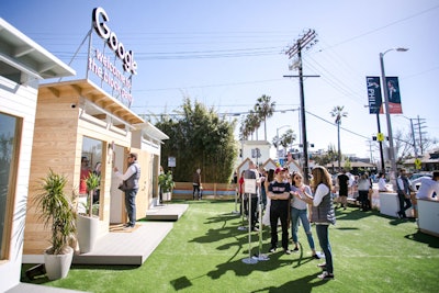 Three tiny homes served as the focal point of the activation, with signage welcoming people to the event.