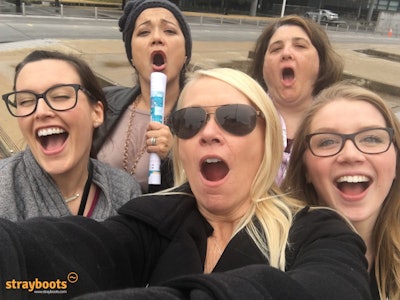Our team building activities always involve fun things to do, like singing in the streets.